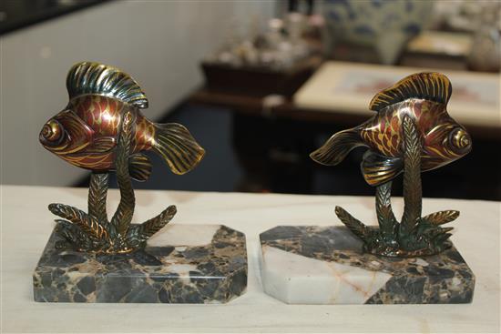 A pair of French Art Deco painted bronze bookends, modelled as fish amongst reeds, 5.5in.